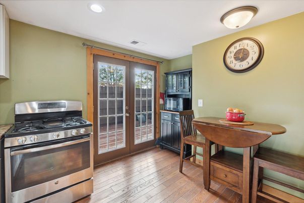 Dining room, Interior, Kitchen, Recessed Lighting, Stainless Steel Appliances, Wood Texture Flooring