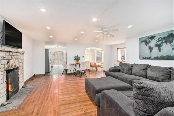 Dining room, Fireplace, Interior, Living room, Recessed Lighting, Wood Texture Flooring