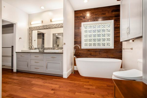 Bathroom, Dual Sink Vanities, Free Standing Baths, Interior, Recessed Lighting, Wood Texture Flooring, Wooden Walls