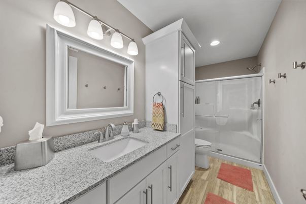 Bathroom, Dual Sink Vanities, Glass Shower, Interior, Recessed Lighting, Wood Texture Flooring