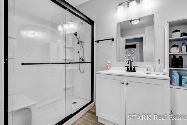 Bathroom, Dual Sink Vanities, Glass Shower, Interior, Wood Texture Flooring