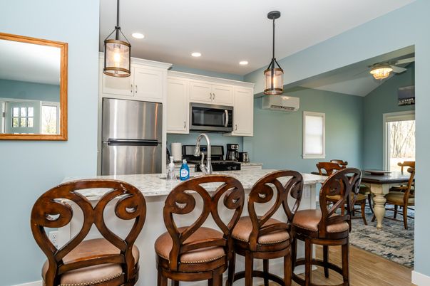 Dining room, Interior, Kitchen, Pendant Lights, Recessed Lighting, Stainless Steel Appliances, Wood Texture Flooring