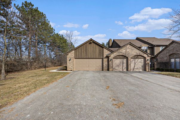 Attached, Backyard, Exterior, Facade, Brick Facade, Tudor Revival