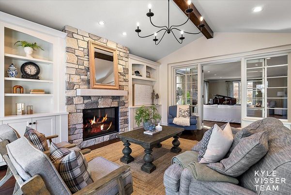 Chandelier, Fireplace, Interior, Living room, Piano, Recessed Lighting, Stone Walls, Wooden Beams, Wood Texture Flooring