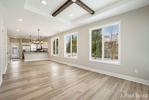 Empty room, Interior, Kitchen, Pendant Lights, Recessed Lighting, Stainless Steel Appliances, Wooden Beams, Wood Texture Flooring