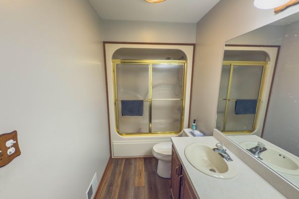 Bathroom, Dual Sink Vanities, Glass Shower, Interior, Wood Texture Flooring