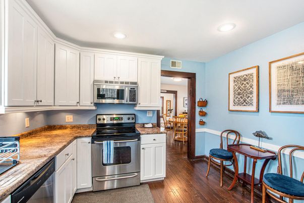 Dining room, Interior, Kitchen, Recessed Lighting, Stainless Steel Appliances, Wood Texture Flooring
