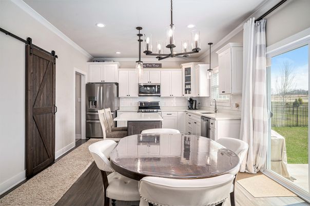 Dining room, Interior, Kitchen, Pendant Lights, Recessed Lighting, Stainless Steel Appliances, Wood Texture Flooring