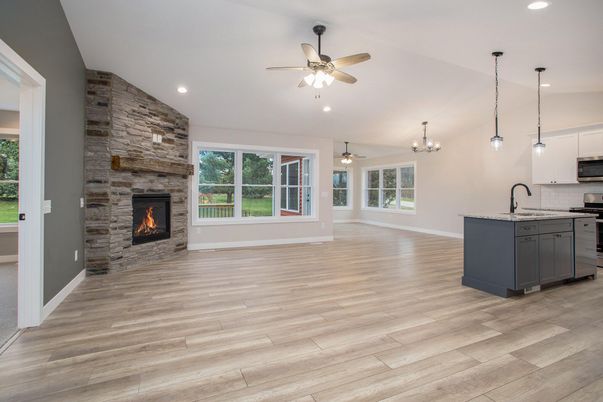 Chandelier, Empty room, Fireplace, Interior, Kitchen, Pendant Lights, Recessed Lighting, Stone Walls, Wood Texture Flooring