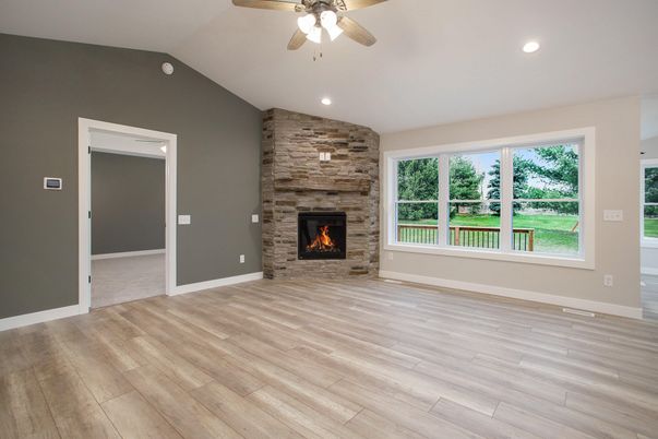 Empty room, Fireplace, Interior, Recessed Lighting, Stone Walls, Wood Texture Flooring