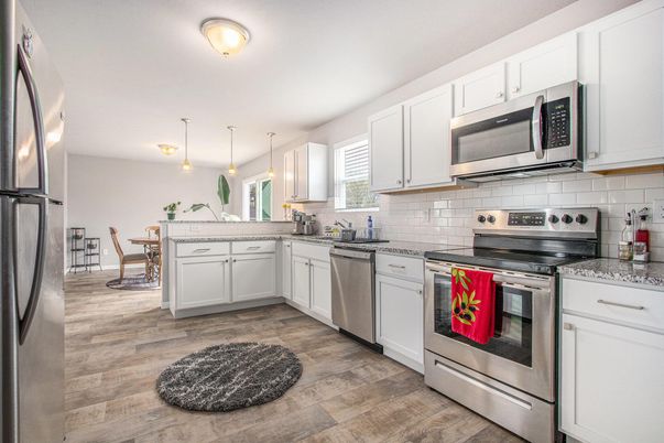 Dining room, Interior, Kitchen, Pendant Lights, Stainless Steel Appliances, Wood Texture Flooring