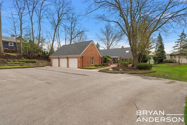 Attached, Backyard, Detached Garage, Exterior, Facade, Brick Facade, Cape Cod