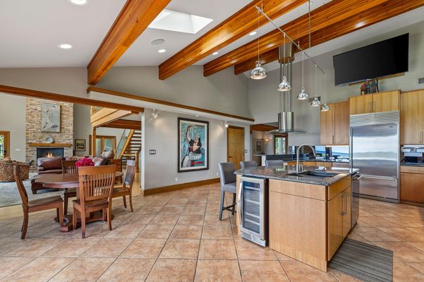 Dining room, Fireplace, Interior, Kitchen, Living room, Pendant Lights, Recessed Lighting, Stainless Steel Appliances, Stone Walls, Wooden Beams