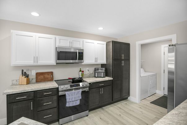 Interior, Kitchen, Recessed Lighting, Stainless Steel Appliances, Washer, Wood Texture Flooring