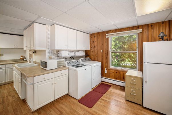 Interior, Kitchen, Washer, Wood Texture Flooring, Wooden Walls