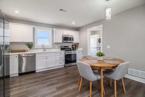 Dining room, Interior, Kitchen, Pendant Lights, Recessed Lighting, Stainless Steel Appliances, Wood Texture Flooring