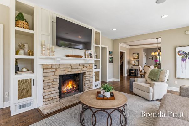 Chandelier, Dining room, Fireplace, Interior, Living room, Pendant Lights, Recessed Lighting, Wood Texture Flooring
