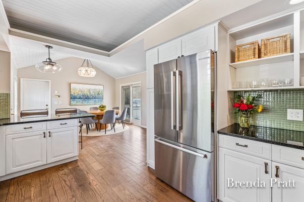 Chandelier, Dining room, Interior, Kitchen, Pendant Lights, Stainless Steel Appliances, Wood Texture Flooring