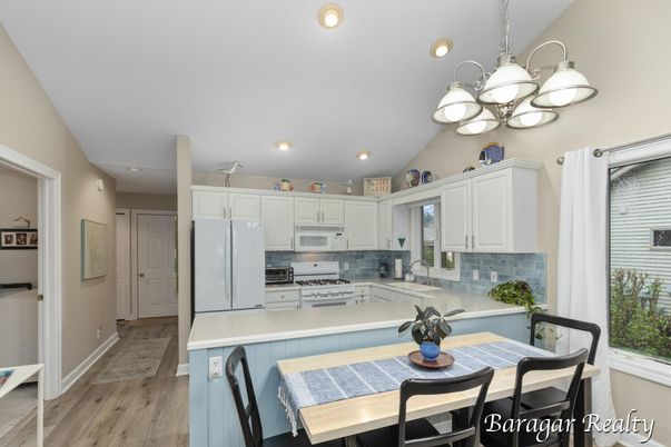 Dining room, Interior, Kitchen, Pendant Lights, Recessed Lighting, Stainless Steel Appliances, Wood Texture Flooring