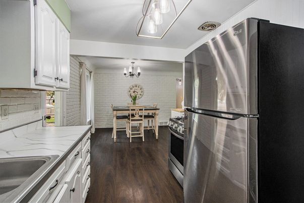 Chandelier, Dining room, Interior, Kitchen, Stainless Steel Appliances, Stone Walls, Wood Texture Flooring