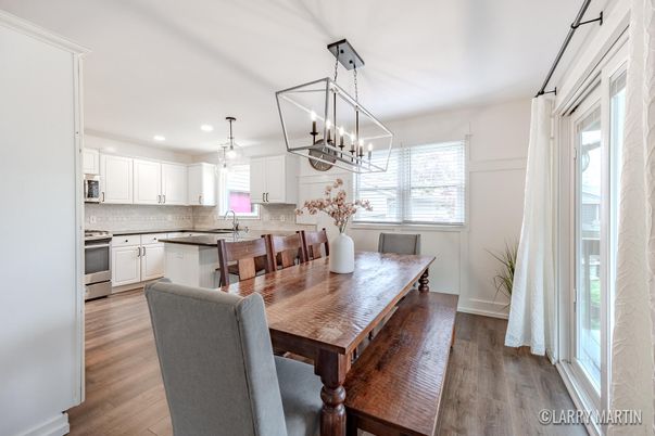 Chandelier, Dining room, Interior, Kitchen, Pendant Lights, Recessed Lighting, Stainless Steel Appliances, Wood Texture Flooring