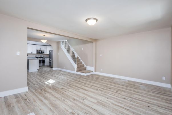 Empty room, Interior, Kitchen, Stainless Steel Appliances, Wood Texture Flooring