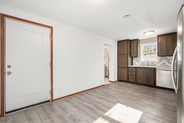 Empty room, Interior, Kitchen, Stainless Steel Appliances, Wood Texture Flooring