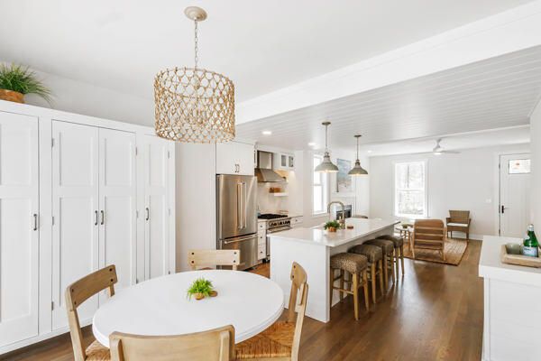 Chandelier, Dining room, Interior, Kitchen, Living room, Pendant Lights, Recessed Lighting, Stainless Steel Appliances, Wood Texture Flooring