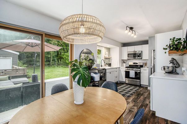 Chandelier, Dining room, Interior, Kitchen, Pendant Lights, Stainless Steel Appliances, Wood Texture Flooring
