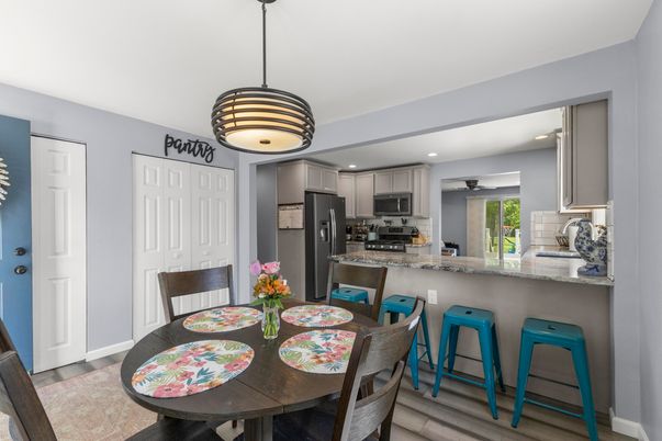 Dining room, Interior, Kitchen, Pendant Lights, Recessed Lighting, Stainless Steel Appliances, Wood Texture Flooring
