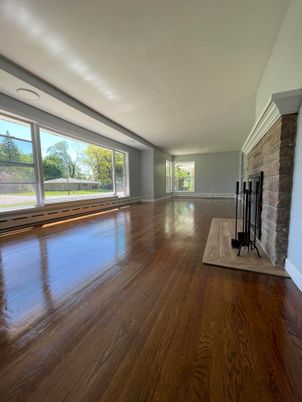 Empty room, Fireplace, Interior, Recessed Lighting, Stone Walls, Wood Texture Flooring