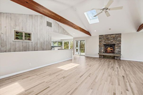Empty room, Fireplace, Interior, Recessed Lighting, Stone Walls, Wooden Beams, Wood Texture Flooring