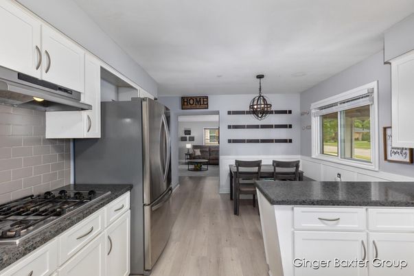 Chandelier, Dining room, Interior, Kitchen, Living room, Pendant Lights, Stainless Steel Appliances, Wood Texture Flooring