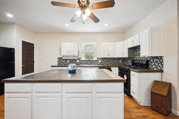Interior, Kitchen, Recessed Lighting, Tile Countertops, Wood Texture Flooring