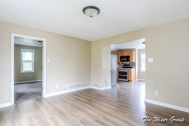 Empty room, Interior, Kitchen, Stainless Steel Appliances, Wood Texture Flooring