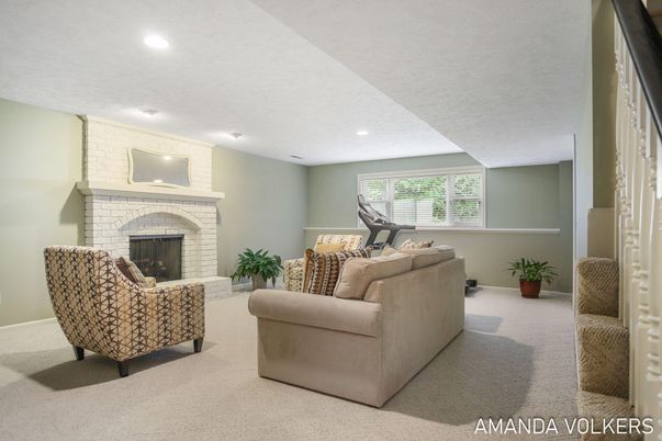 Fireplace, Fitness Equipment, Interior, Living room, Recessed Lighting, Stone Walls