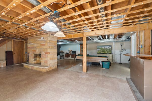 Empty room, Fireplace, Interior, Pendant Lights, Stone Walls, Wooden Beams