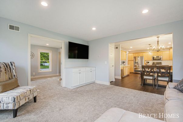 Chandelier, Dining room, Interior, Kitchen, Living room, Recessed Lighting, Stainless Steel Appliances, Wood Texture Flooring
