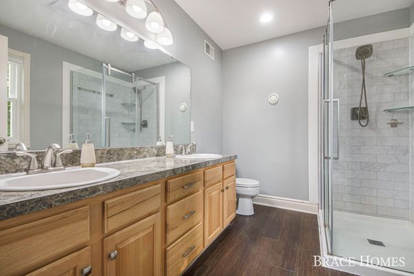 Bathroom, Dual Sink Vanities, Glass Shower, Interior, Recessed Lighting, Wood Texture Flooring