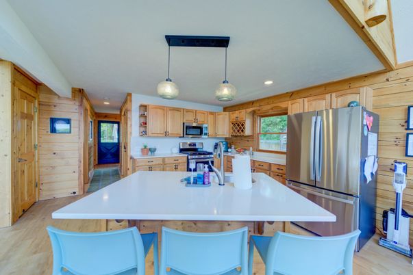 Interior, Kitchen, Pendant Lights, Recessed Lighting, Stainless Steel Appliances, Wood Texture Flooring, Wooden Walls
