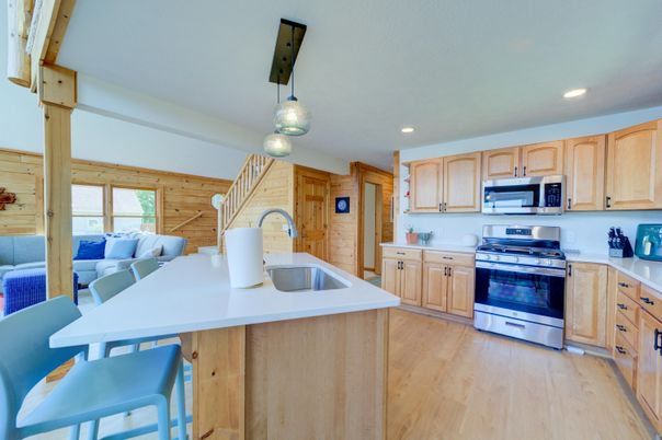 Interior, Kitchen, Pendant Lights, Recessed Lighting, Stainless Steel Appliances, Wood Texture Flooring, Wooden Walls
