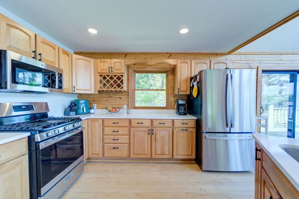 Interior, Kitchen, Recessed Lighting, Stainless Steel Appliances, Wood Texture Flooring, Wooden Walls