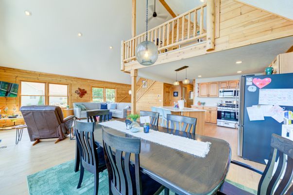 Dining room, Interior, Kitchen, Living room, Pendant Lights, Recessed Lighting, Stainless Steel Appliances, Wood Texture Flooring, Wooden Walls