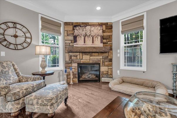 Fireplace, Interior, Living room, Recessed Lighting, Stone Walls, Wood Texture Flooring