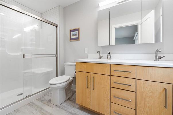 Bathroom, Dual Sink Vanities, Glass Shower, Interior, Wood Texture Flooring