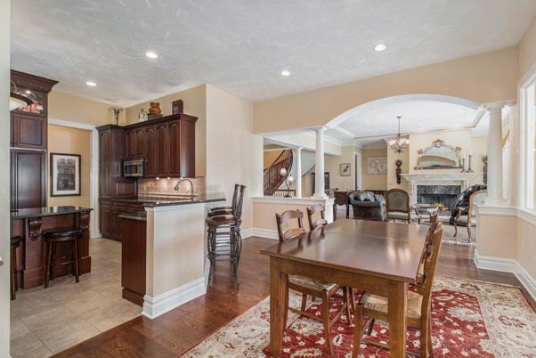 Chandelier, Dining room, Fireplace, Interior, Kitchen, Recessed Lighting, Wood Texture Flooring