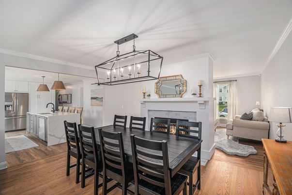Dining room, Fireplace, Interior, Kitchen, Living room, Pendant Lights, Stainless Steel Appliances, Wood Texture Flooring