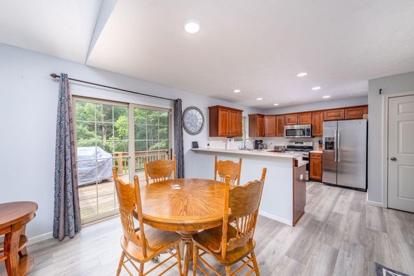 Dining room, Interior, Kitchen, Recessed Lighting, Stainless Steel Appliances, Wood Texture Flooring