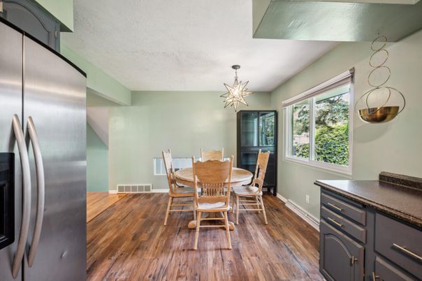 Dining room, Interior, Pendant Lights, Stainless Steel Appliances, Wood Texture Flooring