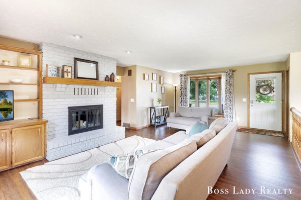 Fireplace, Interior, Living room, Recessed Lighting, Stone Walls, Wood Texture Flooring
